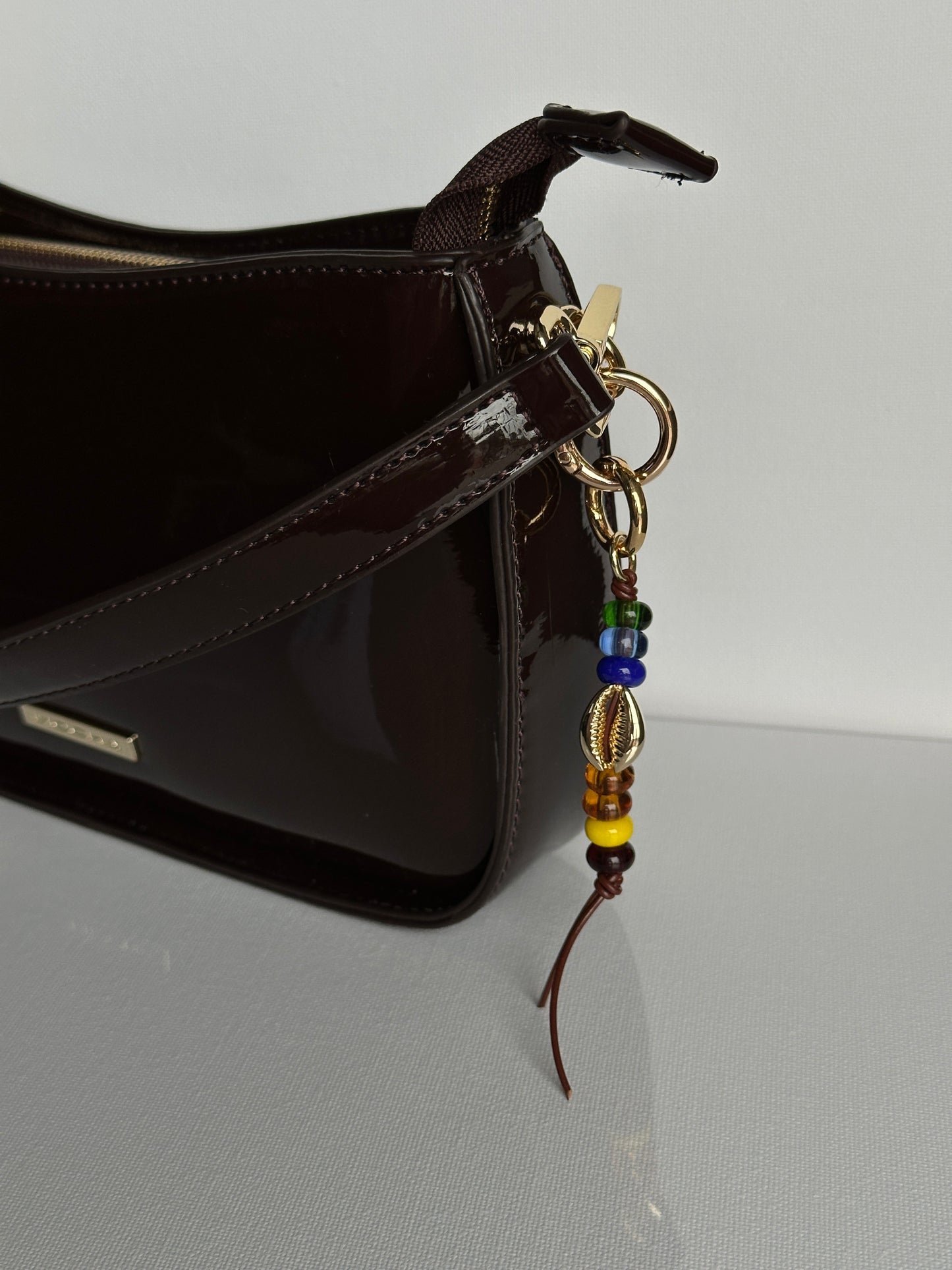 COWRIE bag charm