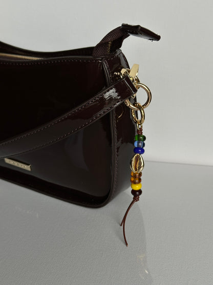 COWRIE bag charm